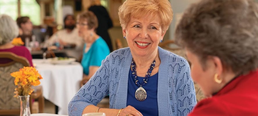 Residents enjoying a meal in a dining room