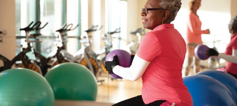 Senior resident exercising in a fitness area