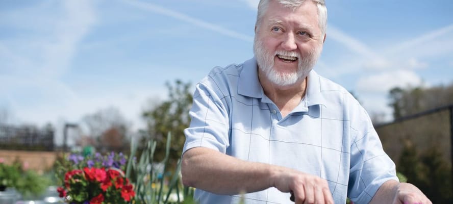 Senior resident gardening in an outdoor space