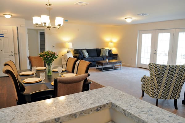 Bright common area with dining table and seating