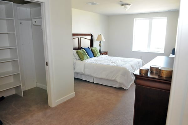 Private resident room with a bed and closet