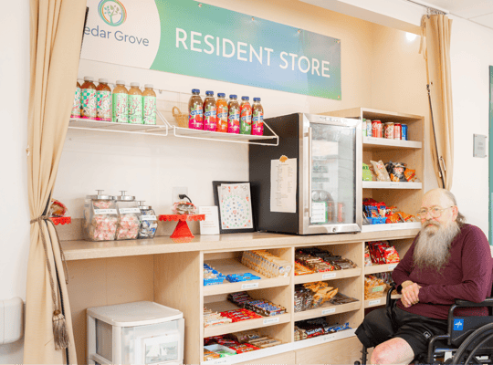 Resident enjoying the store area with snacks