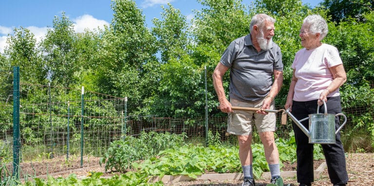 Residents gardening together in a community space