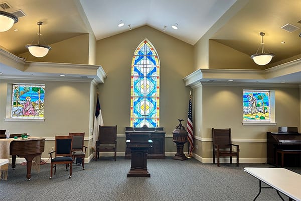 Interior view of a facility common area with stained glass
