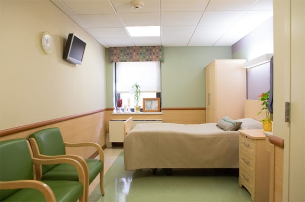 Cozy private room with a bed and seating area