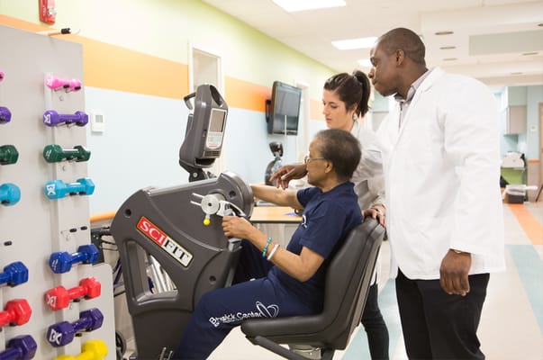 Therapist assisting resident in an activity room