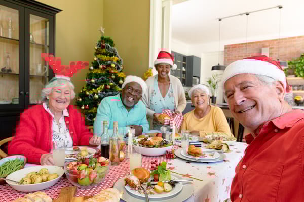 Residents enjoying a festive meal together in a dining area