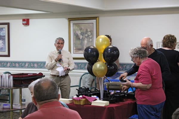 Residents and staff celebrating an event with decorations