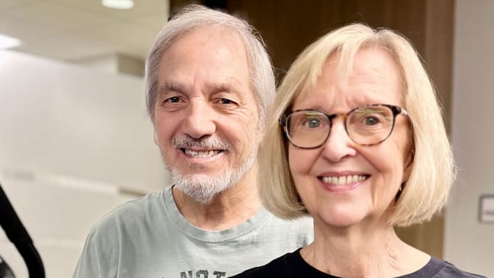 Smiling residents posing together in a common area