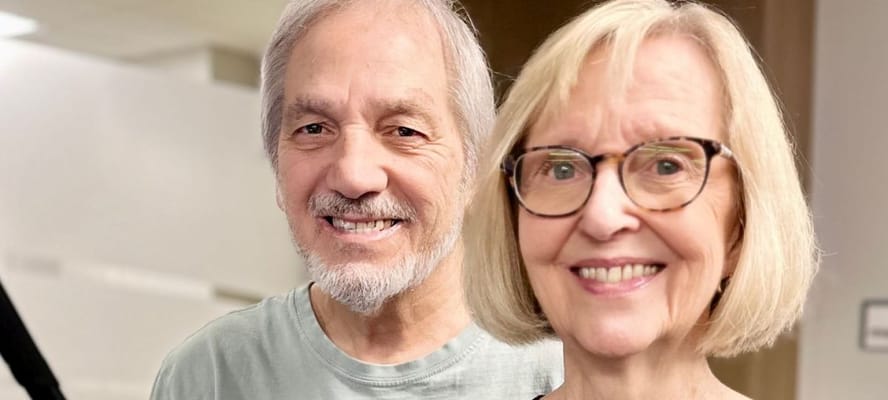 Two residents smiling in a common area