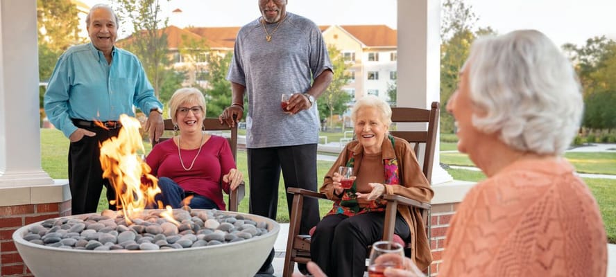 Residents enjoying time around a fire pit