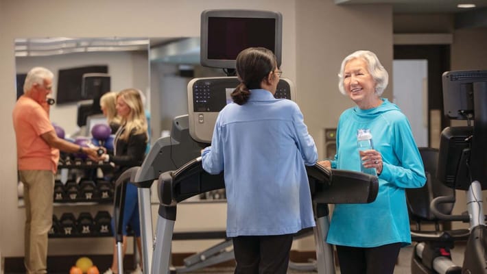 Residents engaging in physical activities with staff support