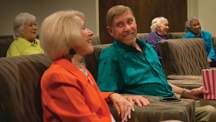 Residents enjoying a light moment in a common area