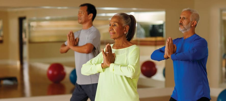 Residents participating in a yoga class indoors