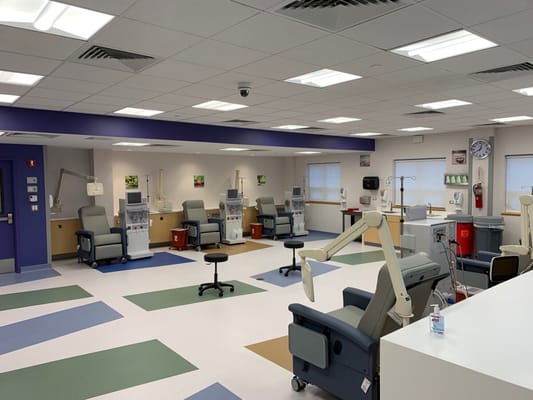Interior view of a treatment area with chairs and equipment