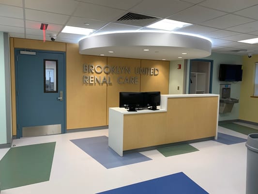 Interior view of a reception area with signage