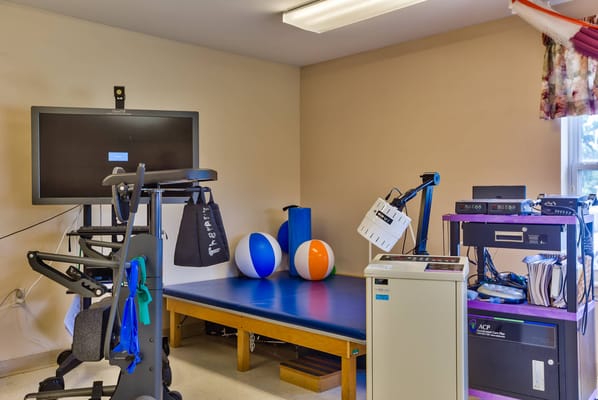 Interior view of a therapy room with equipment