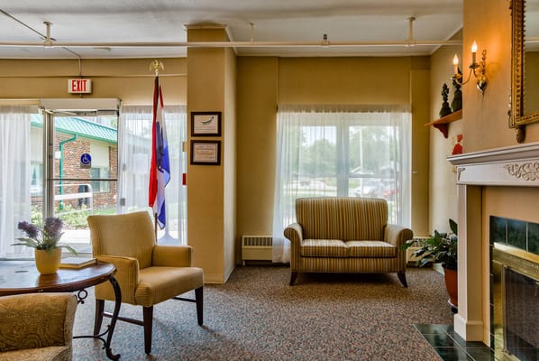 Cozy interior lounge area with seating and windows