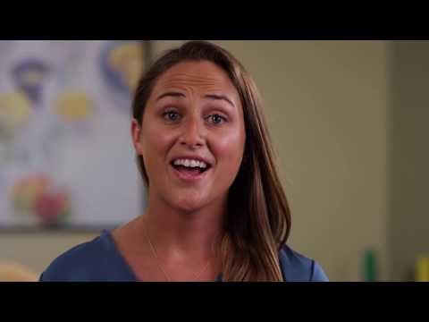 Staff member speaking in a facility room