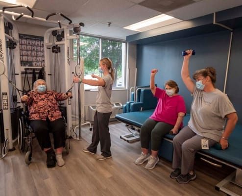 Residents participating in a physical therapy session