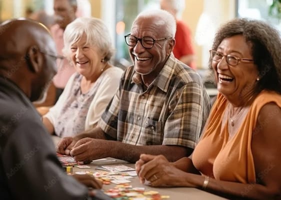 Residents laughing and playing a game in a common area