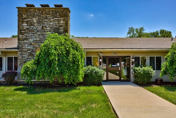 Exterior view of the facility with landscaping