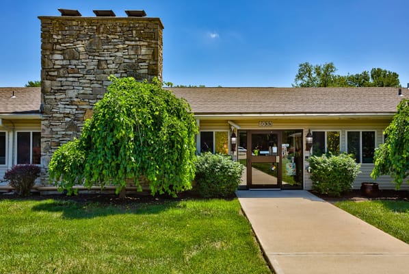 Exterior view of the facility with landscaping