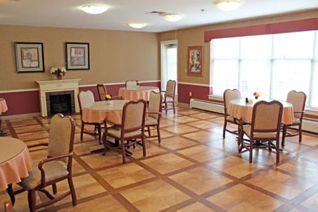 Dining area with tables and chairs in a common room