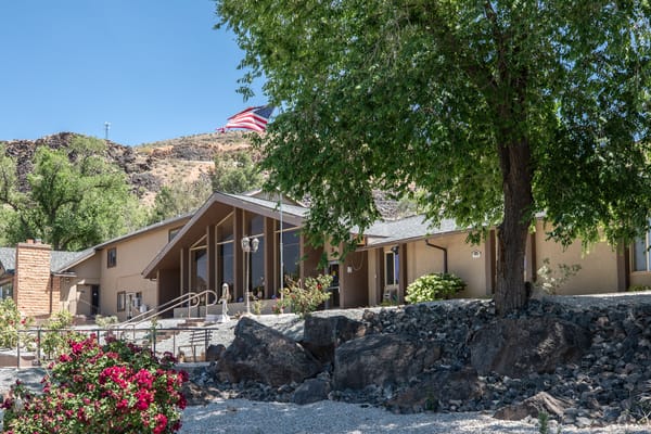 Exterior view of the assisted living facility with landscaping