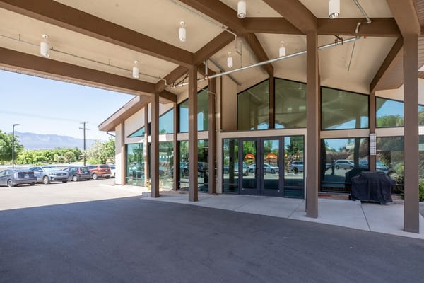 Entrance of a senior living facility with large windows