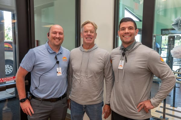 Staff members posing for a photo in the lobby