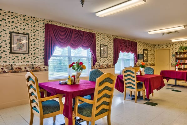 Dining area with tables set for residents