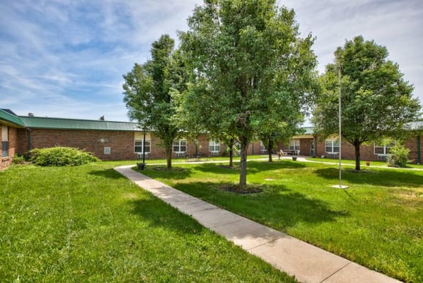 Pathway in a well-maintained garden area of the facility
