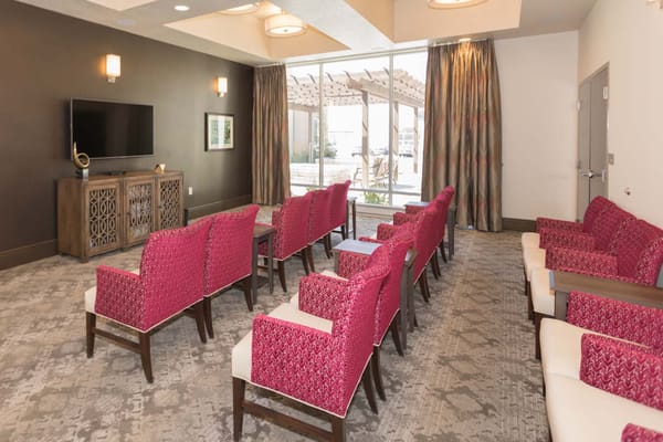 Bright common area with seating and television