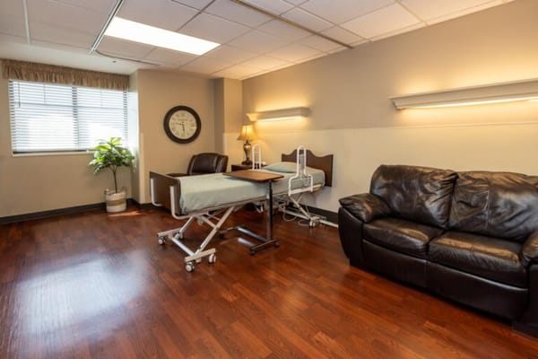 Interior view of a resident room with a bed and couch
