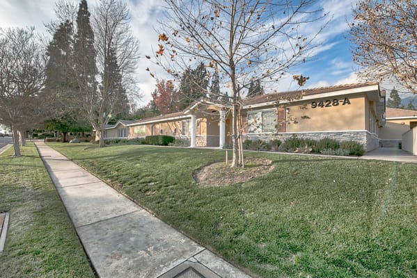 Exterior view of the assisted living facility with garden space
