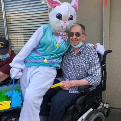 Resident with the Easter Bunny during a celebration