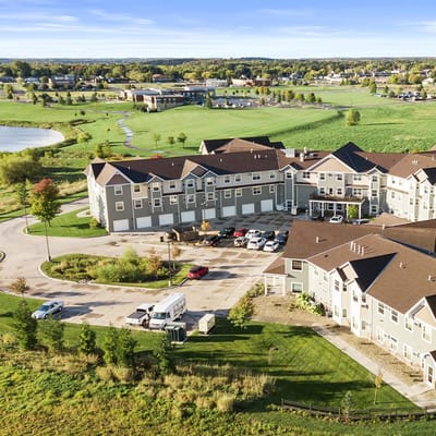 Aerial view of an assisted living facility surrounded by greenery