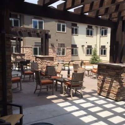 Outdoor seating area with comfortable chairs and tables