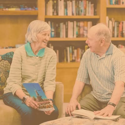 Residents sharing a joyful moment in a common area