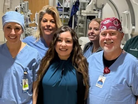 Healthcare staff posing together in a facility setting