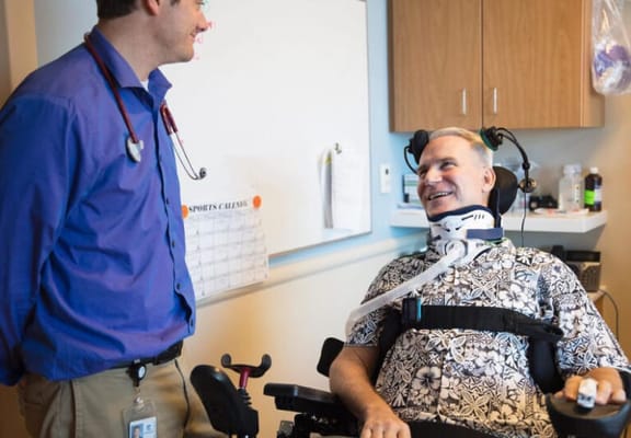 Staff member interacting with a resident in a therapy room