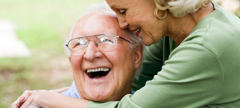 Older couple enjoying each other's company outdoors