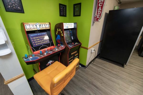 Two arcade game machines in a recreation area