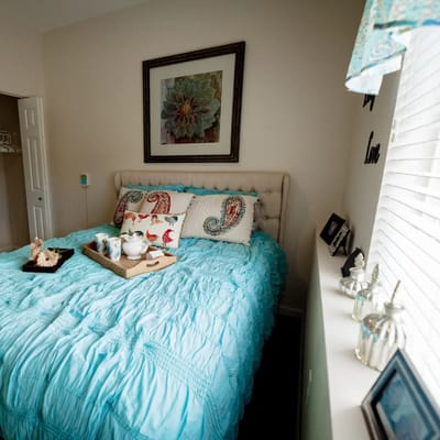 Cozy bedroom setup with decorative bedding