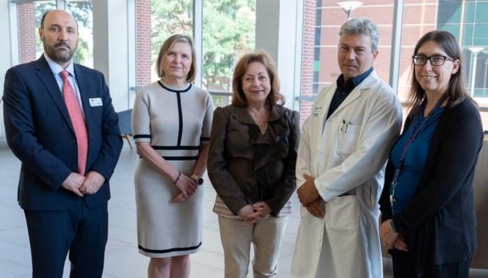 Group of staff members in a facility lobby