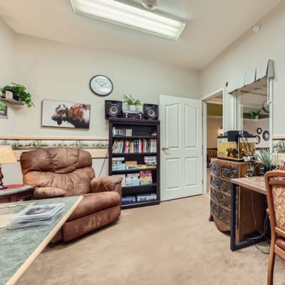 Cozy interior room with a recliner and bookshelf
