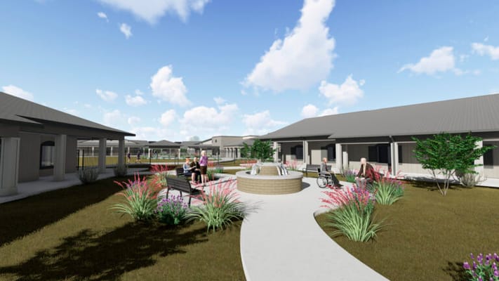 Outdoor garden area with residents and wheelchairs