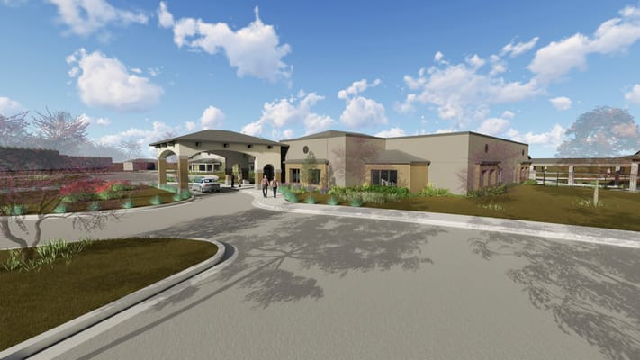 Exterior view of Bluestem Village with residents arriving