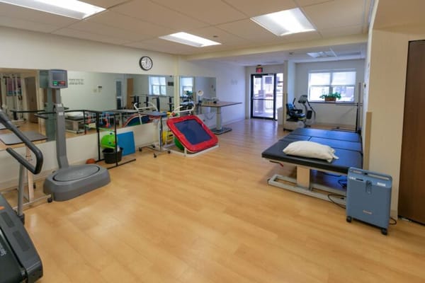 Interior view of a rehabilitation gym with fitness equipment